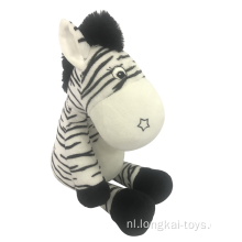 Pluizige zebra met rammelaar